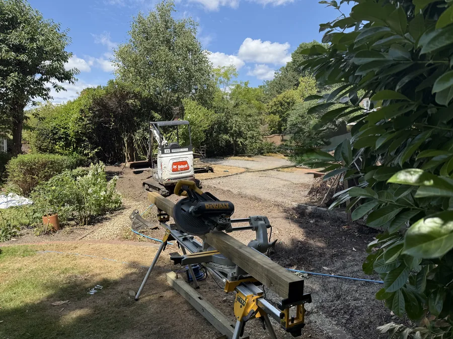 Cleared boundary line with cutting equipment ready for the new fence