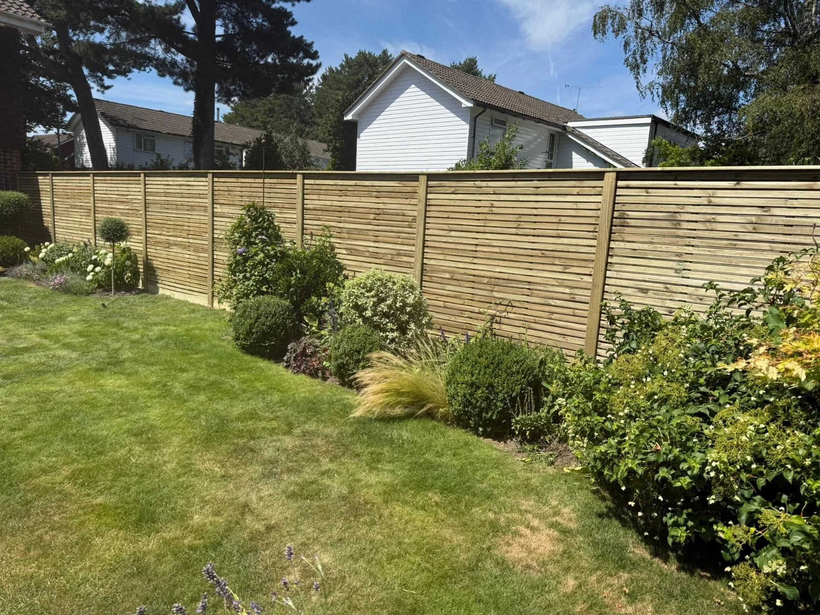 Closeboard fencing on concrete posts
