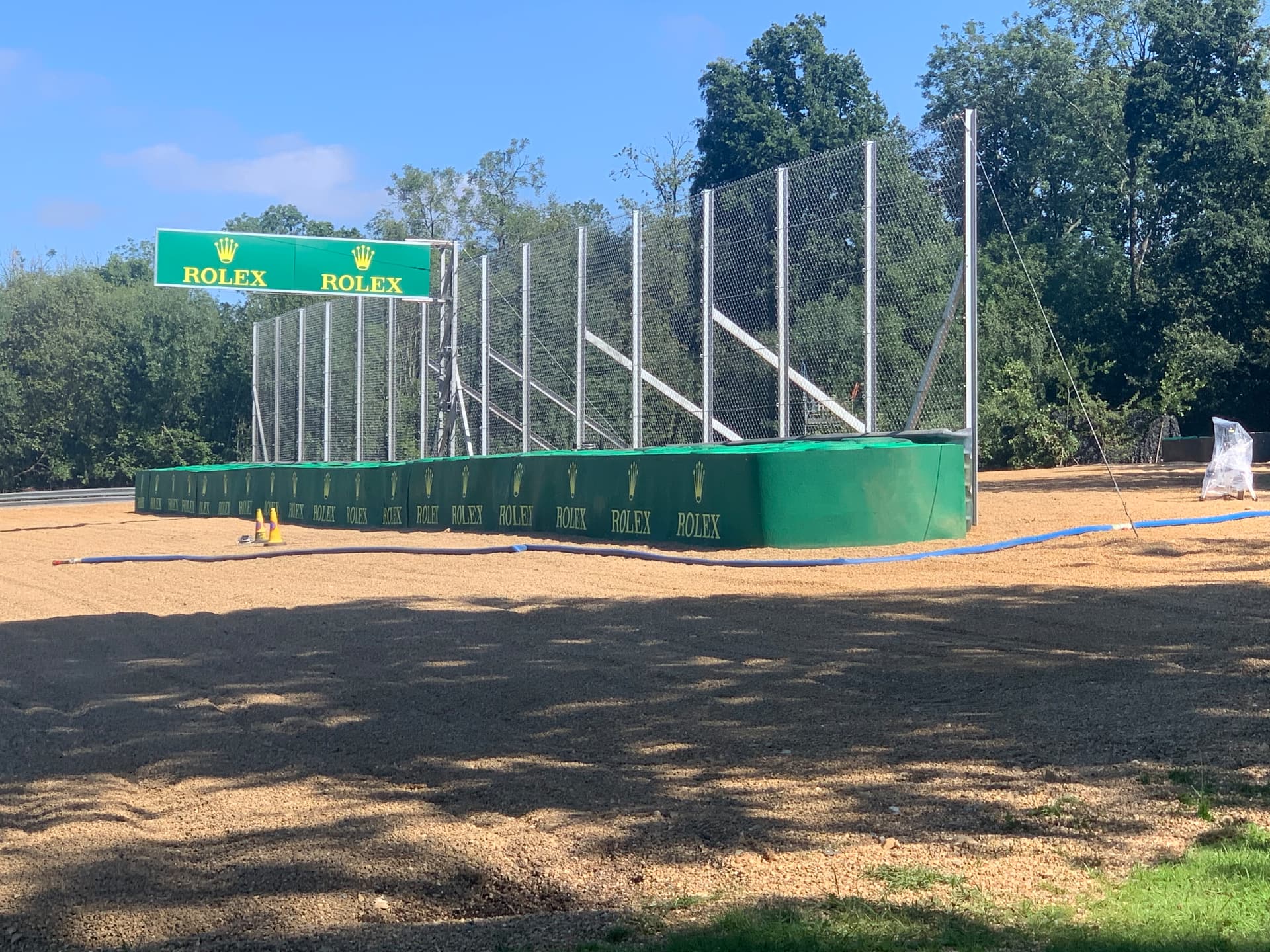 Trackside debris fencing and integrated tyre barrier installation for the F1 production
