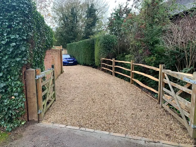 Post and rail entrance with timber gates, view 2