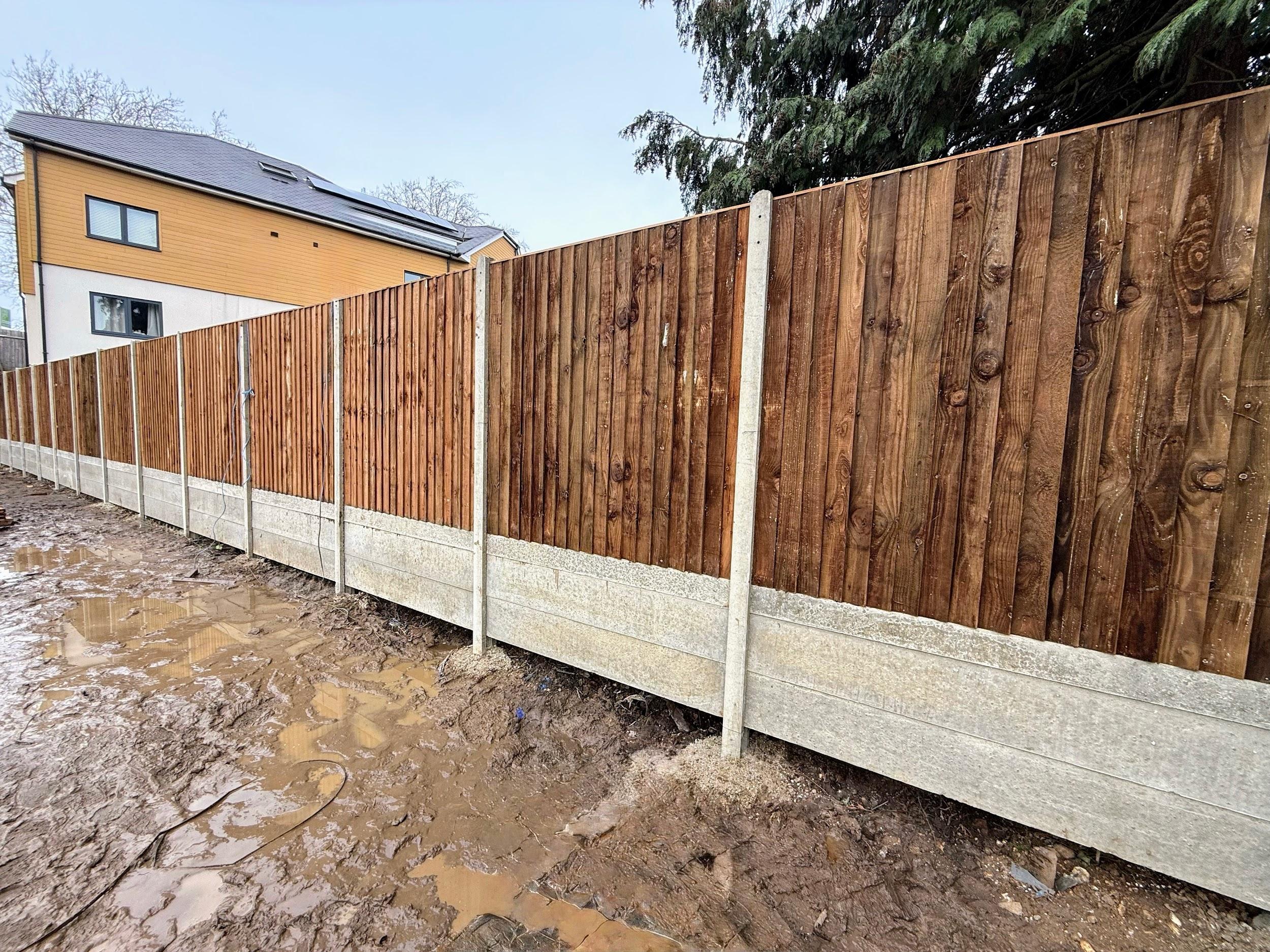 Close board panels with concrete posts and gravel boards