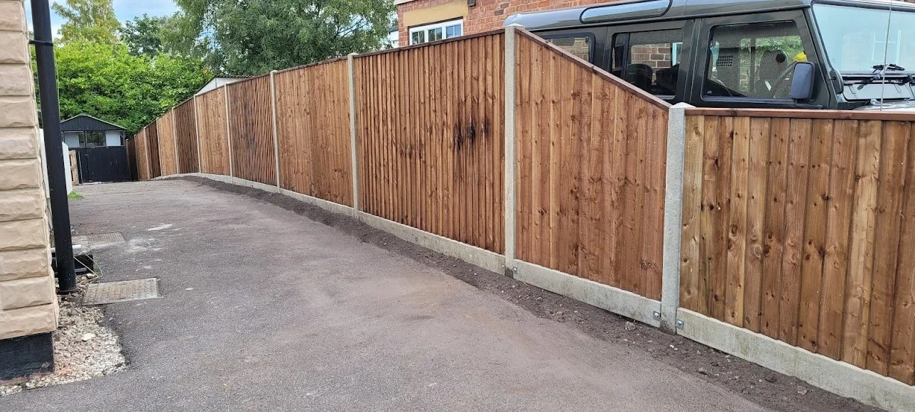 New wooden privacy fence along a driveway in Bracknell